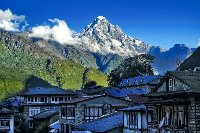 A view of Machhapuchhre (Fishtail Mountain) towering over the stone houses of Ghandruk Village in Nepal.