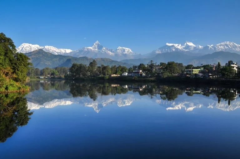 Phewa Lake reflection of Annapurna range and Machhapuchhre mountain in Pokhara Nepal.
